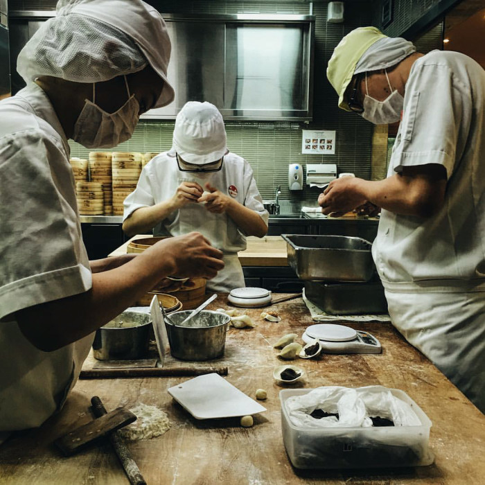 Meticulously making dumplings at Din Tai Fung